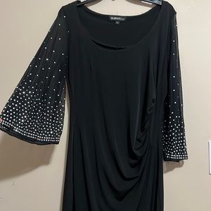 Beautiful black long sleeve embellished dress. Size 8.